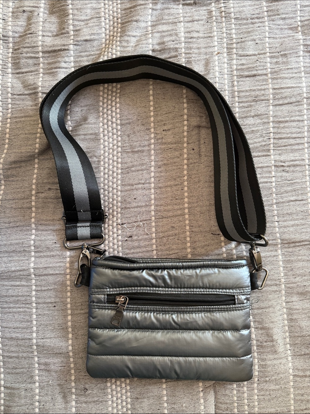 THINK ROYLN Metallic Gray Quilted Crossbody Bag with Striped Strap